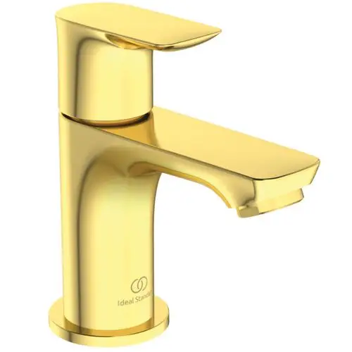 Goldenes Standventil von Ideal Standard mit einer glatten Oberfläche und einer modernen Form. Das Wasser fließt durch einen unteren Auslass.